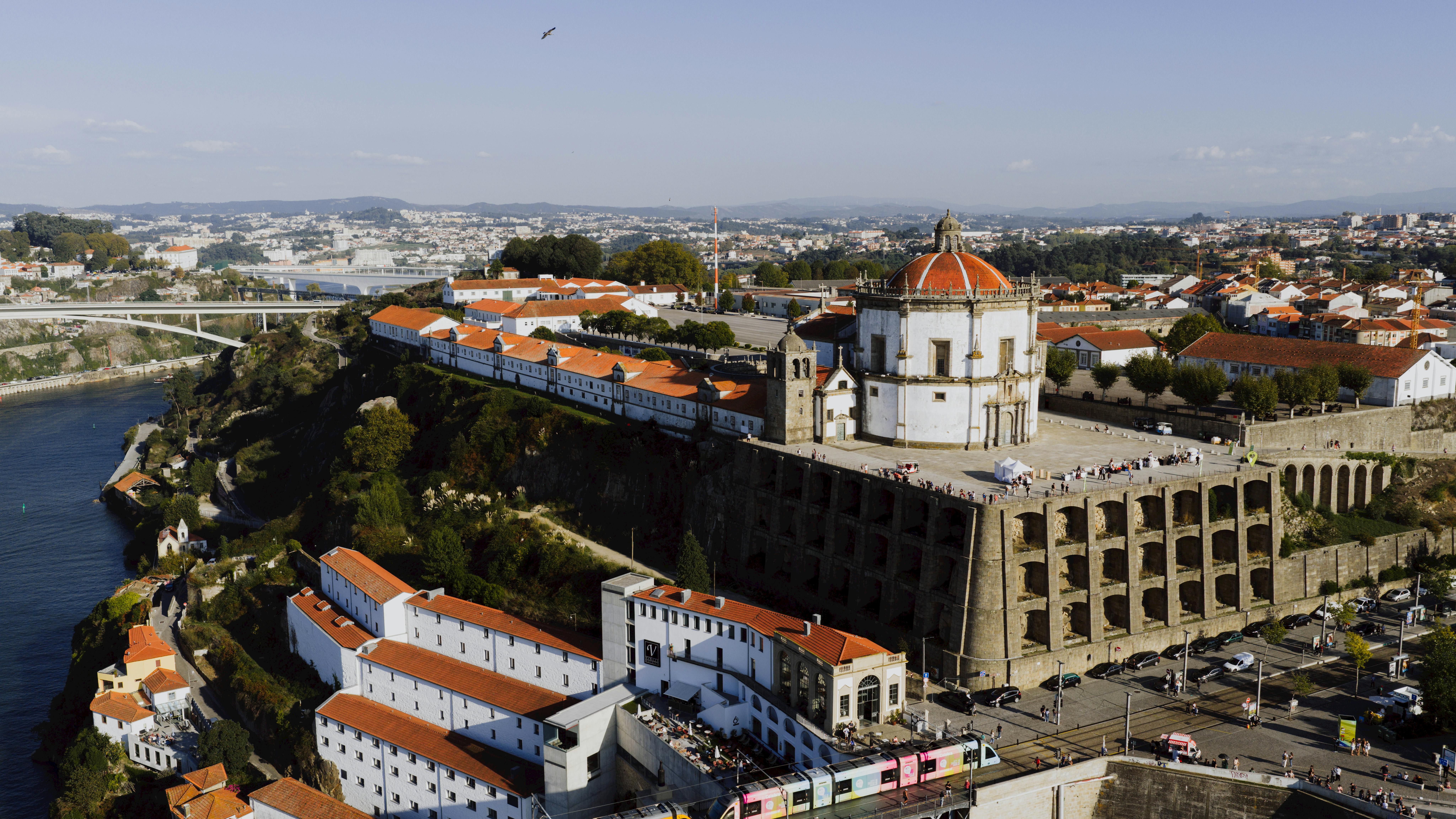 A stunning aerial view of Porto's Monastery of Serra do Pilar at sunset, showcasing its iconic architecture.
